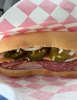 Salami sandwich with jalapeños, onions and cheese