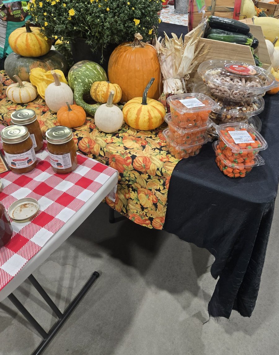 Pumpkins, gourds, mums, squash and pumpkin butter on a fall display at Route 66 Market