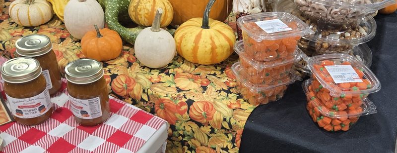 Pumpkin butter, candy and pumpkins on a fall table